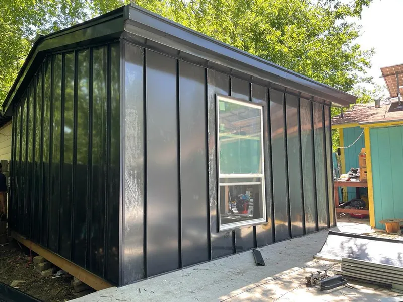 Black standing seam metal wall panels for Metal Roof Installation in West Vincent